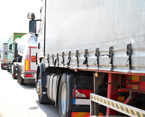 lorries parked up outside a company's car parking area no people stock photo