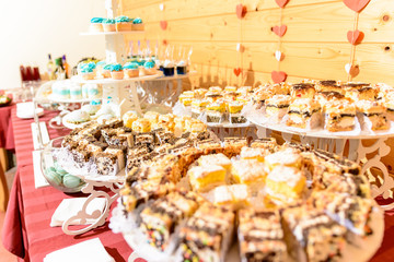 Sweet gourmet buffet table at the wedding in blue tones