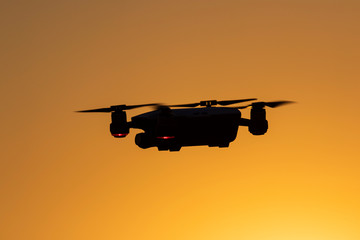 silhouette of drone at sunset