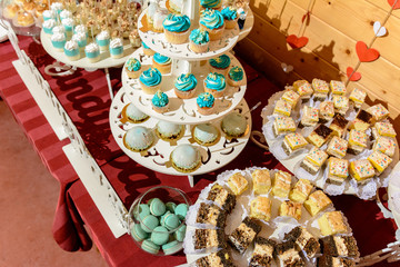 Sweet gourmet buffet table at the wedding in blue tones