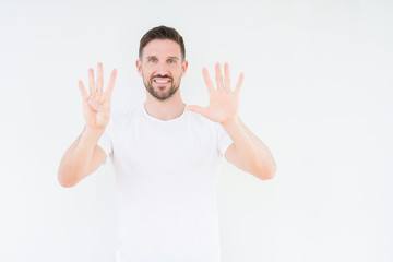 Young handsome man wearing casual white t-shirt over isolated background showing and pointing up with fingers number nine while smiling confident and happy.