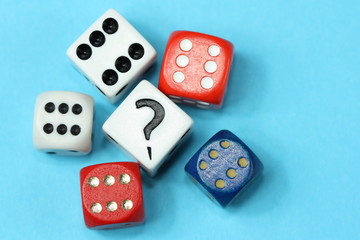 Different dices and question mark.