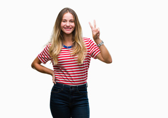 Obraz na płótnie Canvas Young beautiful blonde woman over isolated background showing and pointing up with fingers number two while smiling confident and happy.