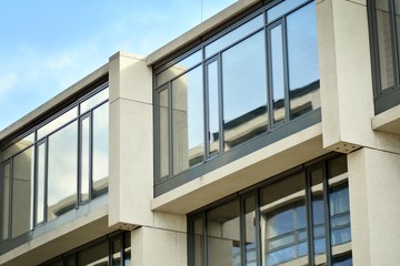 Abstract fragment of modern architecture, walls made of glass and concrete.