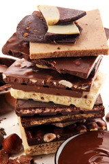 Chocolate bars on table with chocolate tower.