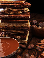 Chocolate bars on table with chocolate tower.