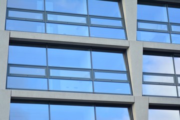 Abstract fragment of modern architecture, walls made of glass and concrete.