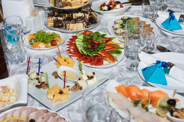 Served wedding table with snacks for different flavors