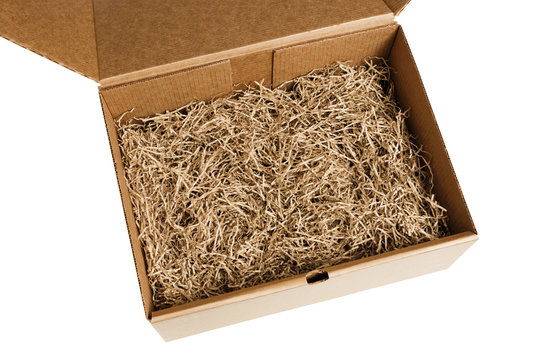Opened gift box with decorative shredded paper for gifting and stuffing.