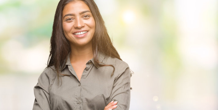 Young beautiful arab woman over isolated background happy face smiling with crossed arms looking at the camera. Positive person.