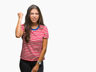Obraz premium Young beautiful arab woman over isolated background angry and mad raising fist frustrated and furious while shouting with anger. Rage and aggressive concept.