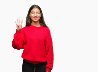 Fototapeta premium Young beautiful arab woman wearing winter sweater over isolated background showing and pointing up with fingers number four while smiling confident and happy.