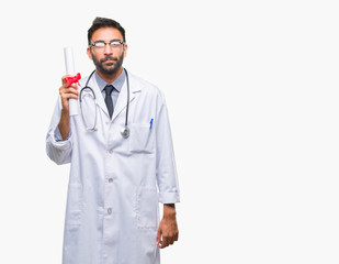 Adult hispanic doctor man holding degree over isolated background with a confident expression on smart face thinking serious
