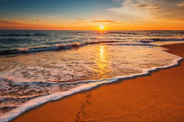 Foto op Canvas Beautiful sunrise over the sea © ValentinValkov