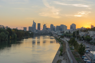 Paris, France - 10 15 2018: View of the towers of La Défense district from the Levallois bridge at sunrise