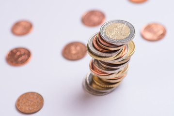 Coins stacked on each other in different positions