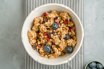 granola with berries and pomegranate seeds