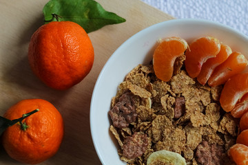 Bowl of homemade granola and fresh berries on a wooden table. Muesli breakfast. Healthy food sweet dessert snack. Diet nutrition concept. Vegetarian food.
