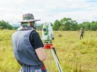 Surveyors conducting topographic surveys in the field.