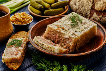 Traditional Russian meat aspic with mustard.