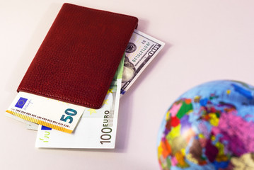 money inside the passport and the globe is out of focus 2