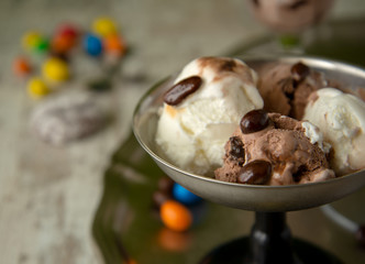 Brown and white ball of ice cream close up