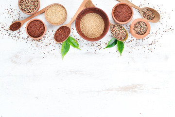Fototapeta na wymiar Set of quinoa On a white wooden background. Top view. Free copy space.