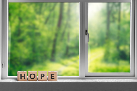 Hope sign in a window sill with a view