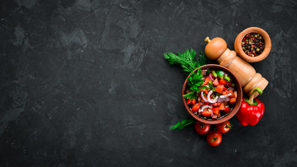 salsa sauce and ingredients. Latin American Mexican Traditional Sauce. Top view. On a black background. Free space for text.