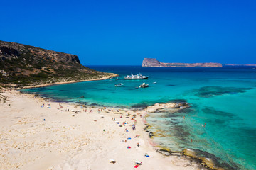 Aerial view of Balos beach near Gramvousa island in Crete. Magical turquoise waters, lagoons, Balos beach of pure white sand. Balos bay in Crete island, Greece.