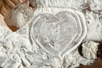 Wheat flour scattered on the table. View top.