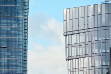 Modern building with reflected sky and cloud in glass window