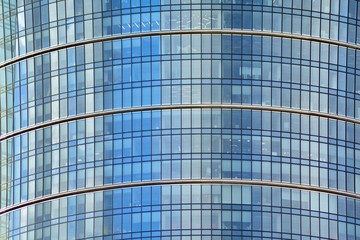 Modern building with reflected sky and cloud in glass window
