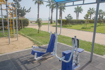 Exercise equipment in a public park in a sunny day