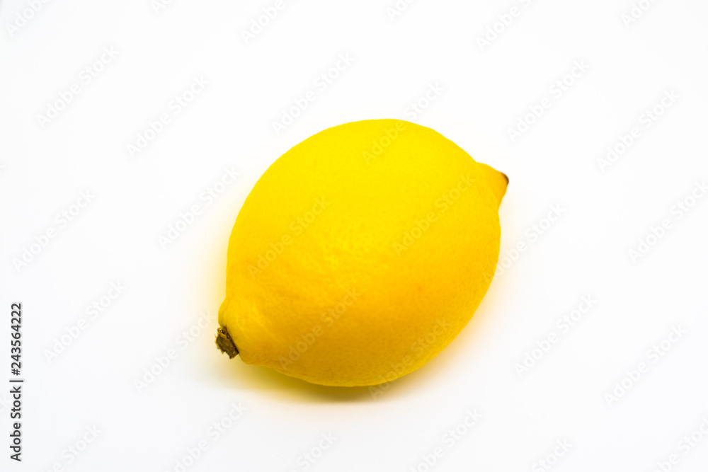 Wall mural a vibrant yellow whole lemon isolated on white background with blank space for text