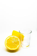 A Mexican tequila shot with lemon on a white isolated background