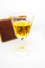 A close-up of a beautiful and elegant glass of white port an alcoholic beverage isolated on a white background