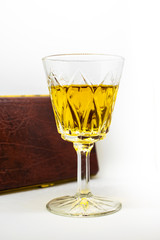 A close-up of a beautiful and elegant glass of white port an alcoholic beverage isolated on a white background