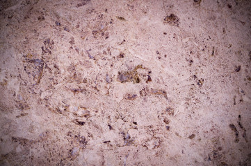 pink marble texture interspersed with quartz. vignette, background, geological.