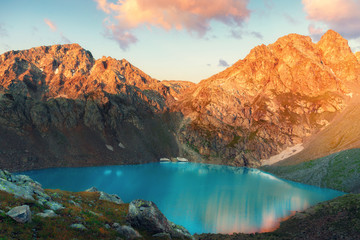 Sophia lake in the mountain of Arkhyz sunrise landscape. The beautiful summer landscape with Caucasus mountain and lake with blue water.