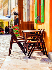 Fototapeta na wymiar cafe on the city street . Tables on street . Restaurant tables . in the open air