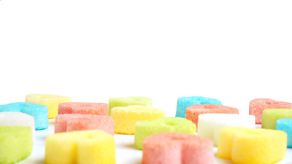 Colorful valentine hearts candy on white background.  Sweets hearts. Valentine’s day symbol. Festive treat. Valentine day background.