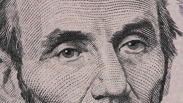 US President Abraham Abe Lincoln on United States 5 dollar bill rotating, five USD. Full HD stock video footage