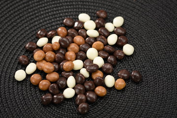  Dark ,white,brown dragee in chocolate cover. 