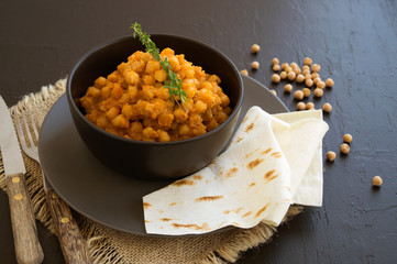Turkish chickpeas stewed in spicy sauce. Oriental dish.
