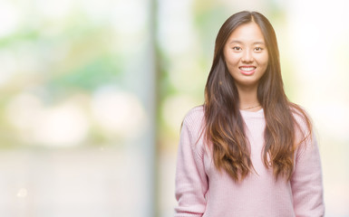 Fototapeta premium Young asian woman over isolated background with a happy and cool smile on face. Lucky person.