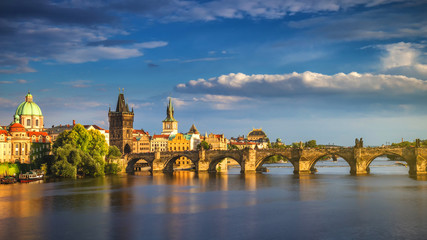 Scenic spring sunset aerial view of the Old Town pier architecture and Charles Bridge over Vltava...