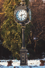 Fototapeta na wymiar Vintage old city clock located in european capital in Bucharest, Romania