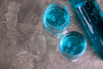 Two glasses and bottle of trendy blue wine. Spanish chardonnay