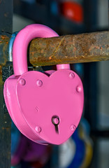 Lovers locks on the pole of the bridge and key thrown into the river.